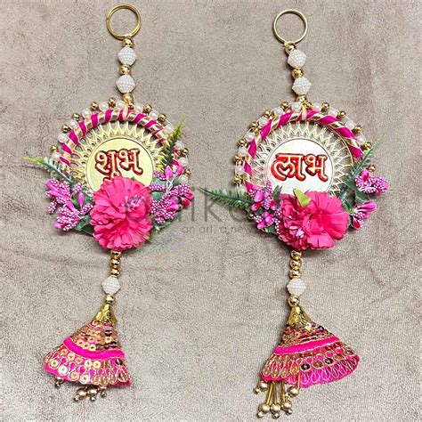 Rani Pink Color Floral With Zari Cone & Subh Labh Hanging Pair ...