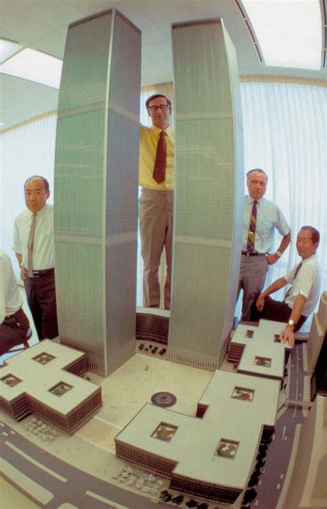 Architect Minoru Yamasaki posing with a model of the World Trade Center ...