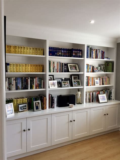 Wall to wall shelving with cupboard storage to base. Useful shelving ...