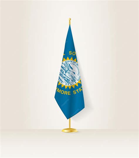 Premium Vector | South dakota flag on a flag stand