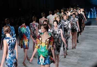 Models present creations by British designer Alexander McQueen as part ...