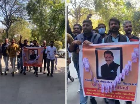 NSUI wearing a garland of rupee on the photo of Education Minister Jitu ...