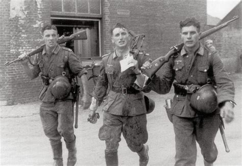 Three German soldiers returning from a recent fight, 1941 - Middle ...