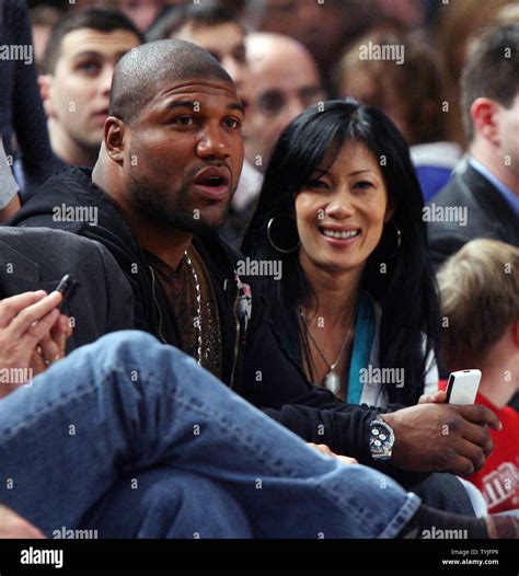Quinton "Rampage" Jackson (L) watches the New York Knicks play the ...