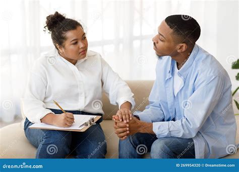 Attentive Hispanic Lady Therapist Supporting Black Man Patient Stock ...