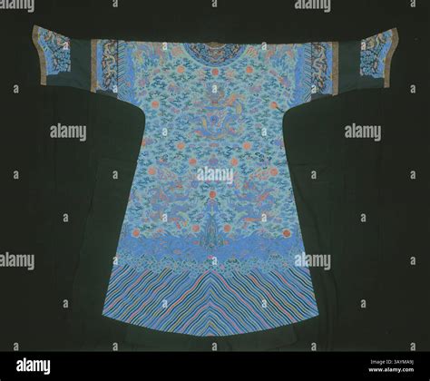 A richly adorned ceremonial robe featuring intricate patterns of ...