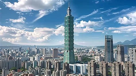 Photo of Taipei 101 tower against a blue sky.