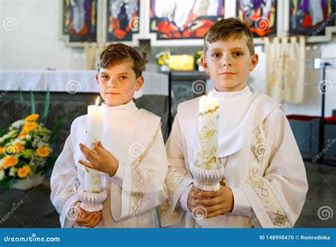 Two Little Kids Boys Receiving His First Holy Communion. Happy Children ...