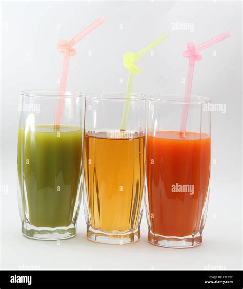 three glasses with juice Stock Photo - Alamy