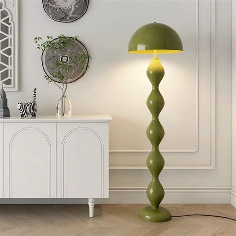 The Mara Floor Lamp boasts a beautiful sculptural design that expertly ...