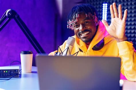 Happy young african man audio blogger broadcasting at studio | Premium ...