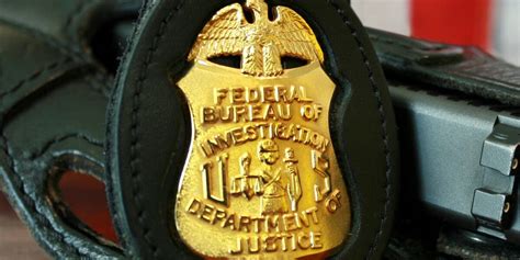 Woman accused of threatening FBI mole in train-guns case