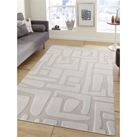 Buy OBSESSIONS Cream Polyester Machine Made Solid Carpet Online