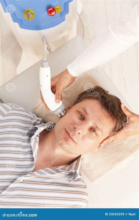 Man Getting Radio Frequency Treatment Stock Image - Image of fourties, european: 23242259
