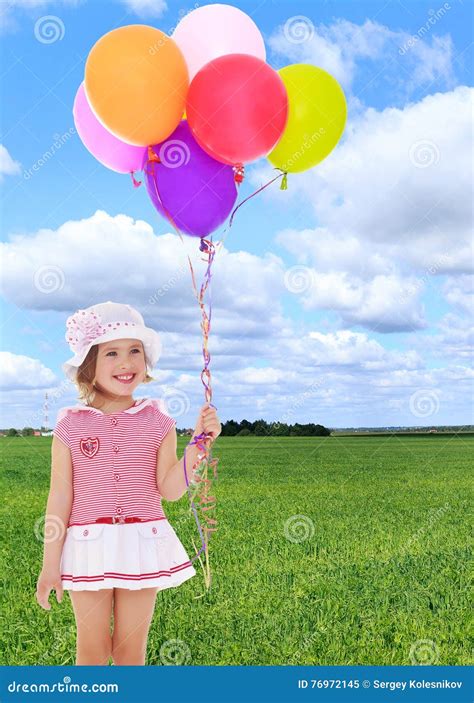 Girl holding balloons stock image. Image of cute, kids - 76972145