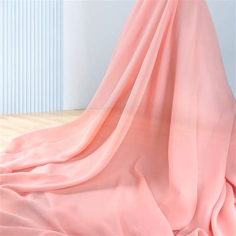 Flat lay of spring summer fabrics including cotton, linen, and chiffon with a beach-inspired background for fashion trend report 2026