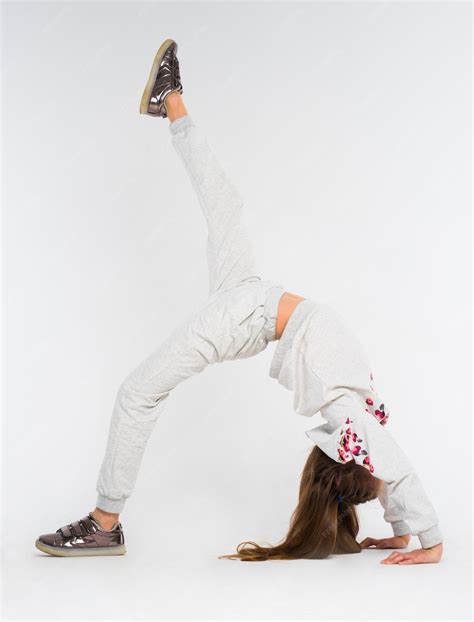Young girl doing bridge position on the one leg support one leg ...
