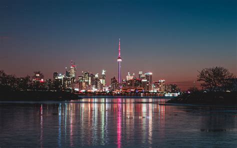 Download wallpaper 1440x900 night city, tower, water widescreen 16:10 ...