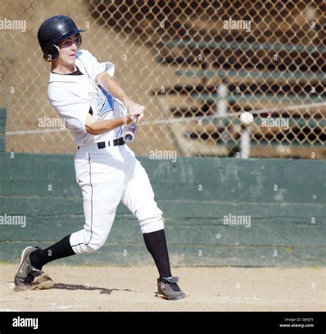 Tennyson's (33) Brian Prentiss hits a single up the middle that scores ...