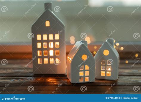 Small Candlestick Christmas Houses With Burning Candle Inside On ...