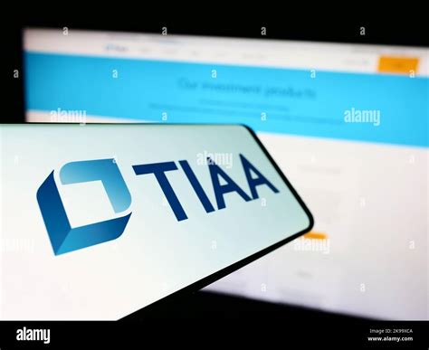 Mobile phone with logo of American financial services company TIAA on ...