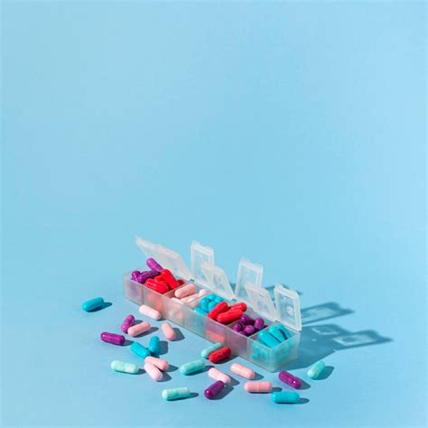 Pills boxes on blue background | Free Photo