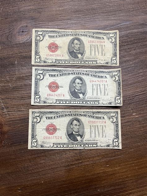 3 - Red Seal $5 Bills - $15 FV - Bosley Auctioneers