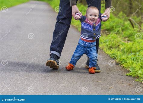 Baby s first steps stock image. Image of happy, outdoors - 54960289