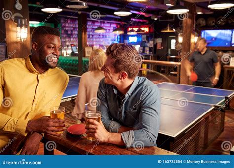Interior of Bar with Customers Drinking and Playing Table Tennis Stock ...