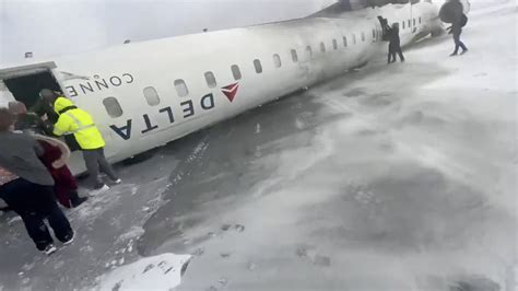 Delta plane crash UPDATES: At least 18 injured after jet flips upside ...