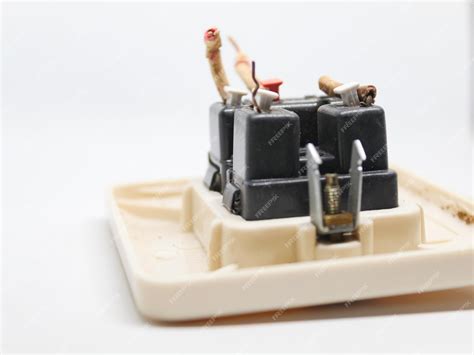 Damaged electrical terminals reveal the wires inside | Premium Photo
