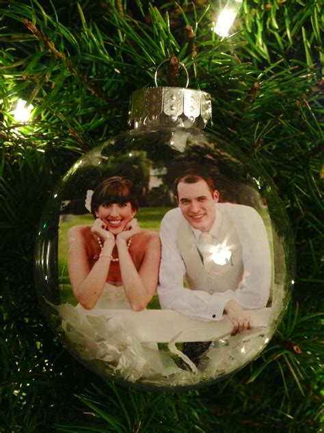Use a clear plastic ornament, cut out a small picture, place it inside ...