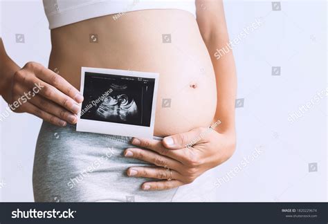 Pregnant Woman Holding Ultrasound Baby Image Stock Photo 1820229674 ...
