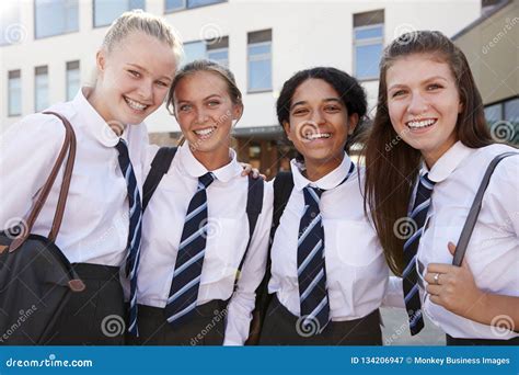 Portrait of Smiling Female High School Students Wearing Uniform Outside ...