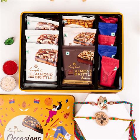 Send Set of 2 Rakhi with Loyka Occasions Assorted Nut Delicacies Online ...
