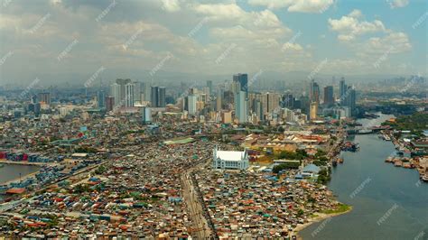 Premium Photo | City of manila the capital of the philippines with modern buildings aerial view