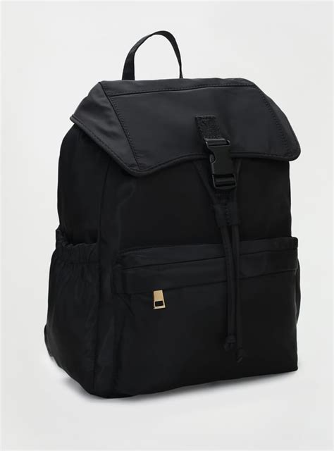 Buy Women Solid Backpack with Flap Online at just Rs. 1499.0 ...