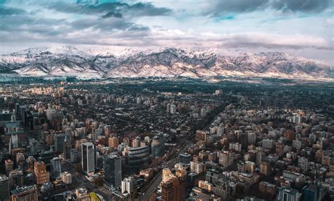 Premium Photo | Santiago de chile and the andes mountains with snow at ...