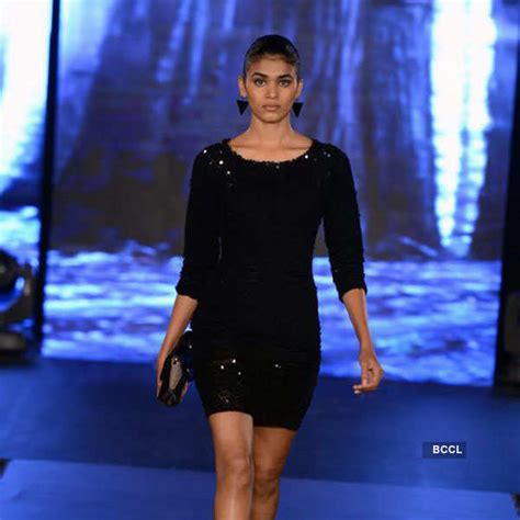 A model walks the ramp during a fashion show organized by Van Heusen to ...
