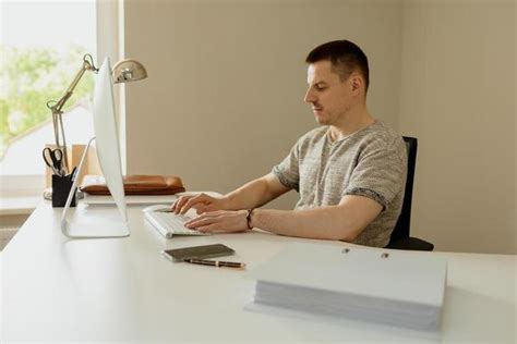 Man at Computer Desk 的图像结果