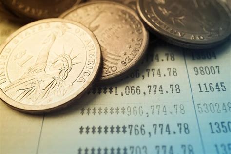 Close-up of coins on paper | Premium Photo