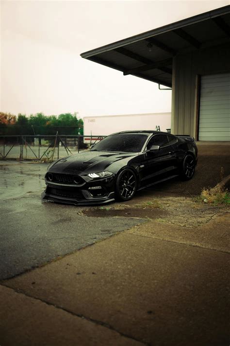 Sleek Black Mustang GT in Urban Setting · Free Stock Photo