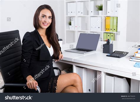 Businesswoman Sitting in Office Stock 的图像结果