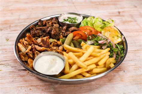 Premium Photo | Mix laham beef chicken dajaj shawarma platter with ...