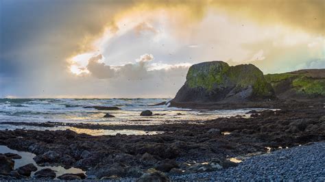 Download wallpaper 2560x1440 cliff, rocks, coast, sunset, sky ...