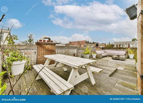 The Deck Has a Picnic Table and Benches on it Stock Image - Image of ...
