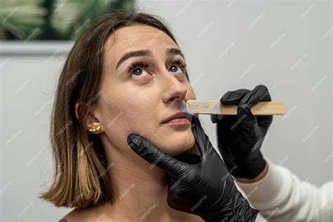 Premium Photo | Young beautiful girl came to the salon to get rid of the lump above the upper ...