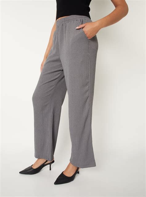 Buy Women Textured Comfort Fit Trousers Online at just Rs. 699.0 ...