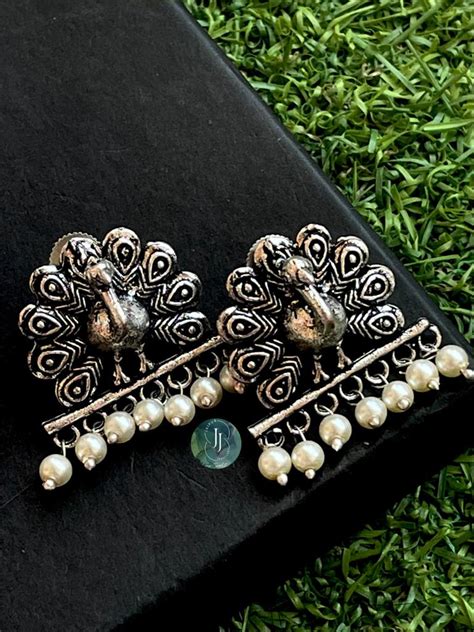 Oxidized Peacock Shape Earring – Prettiq