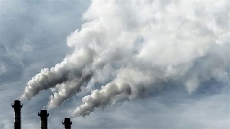Toxic emissions of toxic gases into the atmosphere, industrial air pollution. Dark chimneys ...